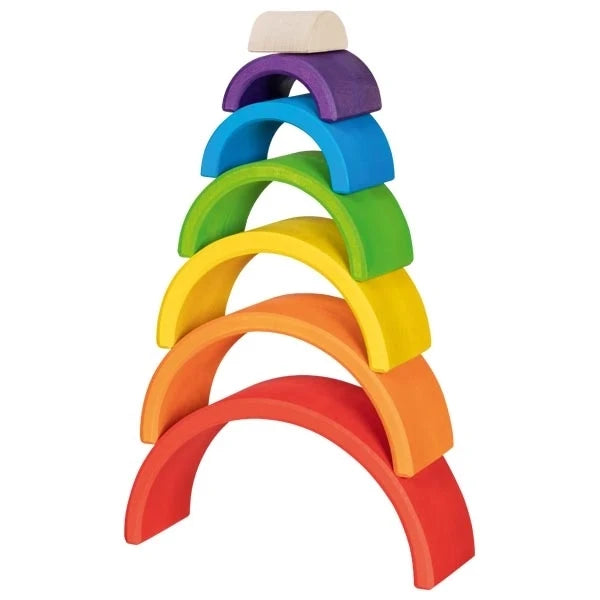 Goki Little Rainbow Building Blocks stacked vertically in a tower on a white background, showing all 7 hand-painted maple wood arches balanced from largest red at the bottom through orange, yellow, green, blue, purple, and natural wood at the top