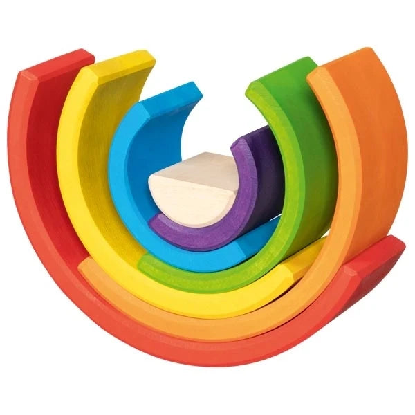 Goki Little Rainbow Building Blocks arranged in a spiral fan formation on a white background, with the arches fanned outward to show all 7 rainbow colors including red, orange, yellow, green, blue, purple, and natural wood