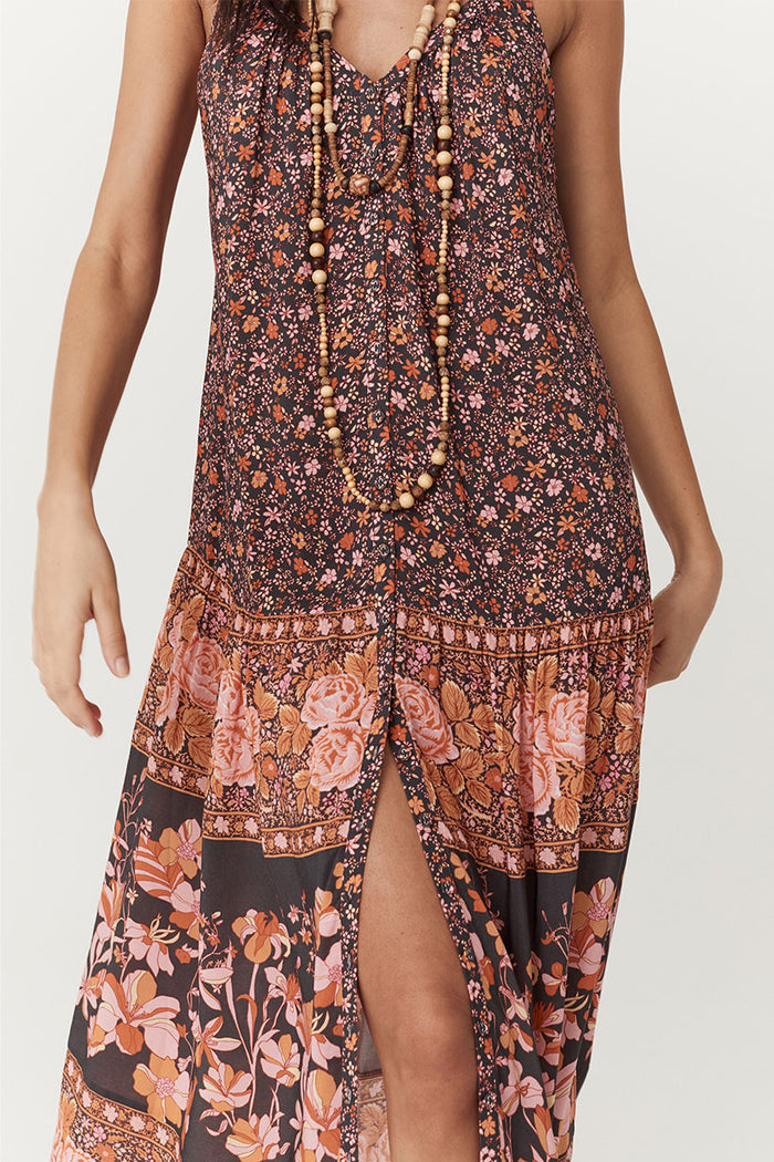 Close-up of border print placement and front slit on Love Jetty Maxi Dress in Balmy Nights, ditsy floral bodice to rose hem