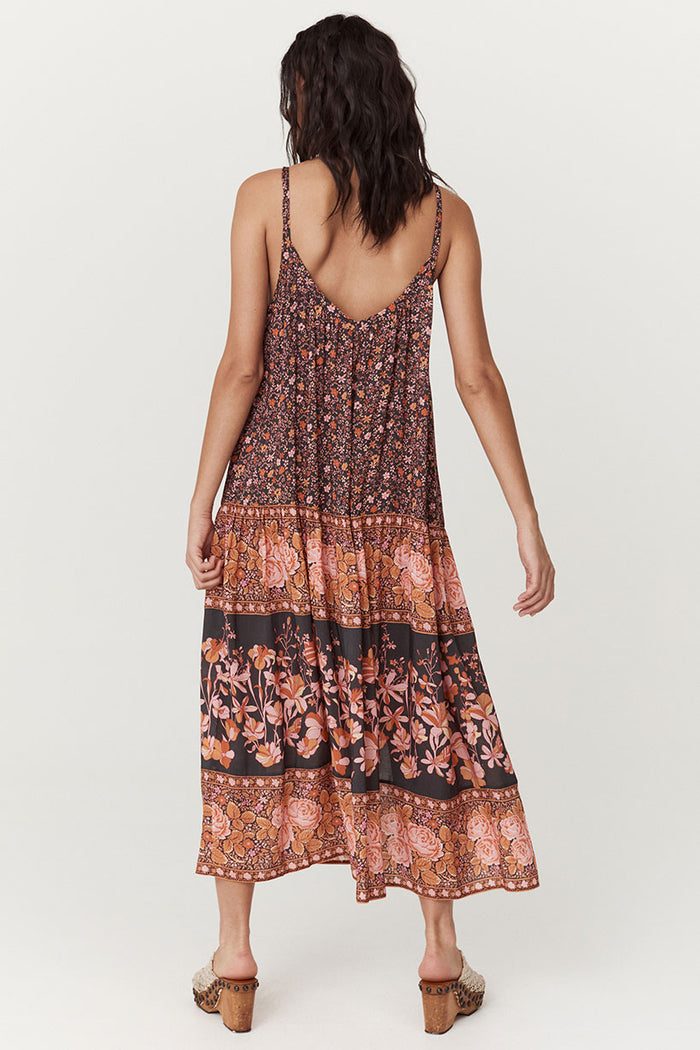 Back view of Love Jetty Strappy Maxi Dress in Balmy Nights showing V-back, fixed straps, and border print tiers