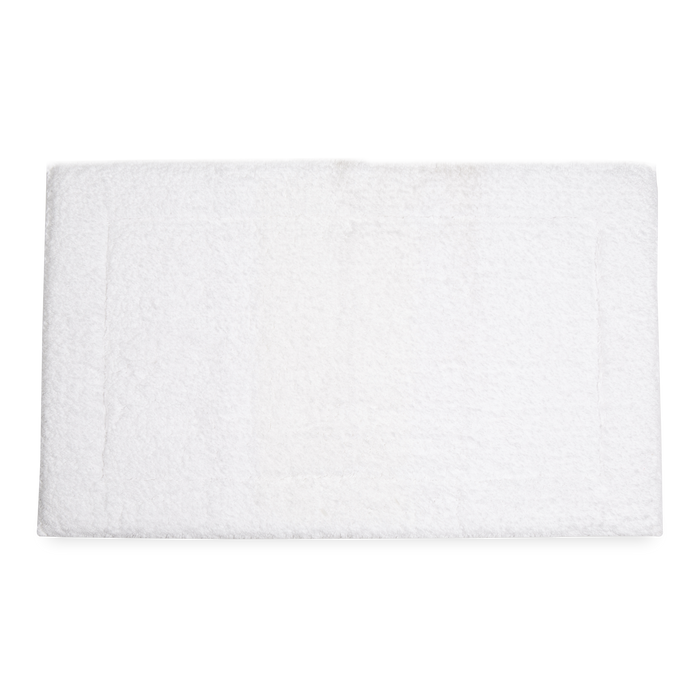 Crafted in a century-old mill in Portugal, this 100% cotton bath rug is fully reversible.