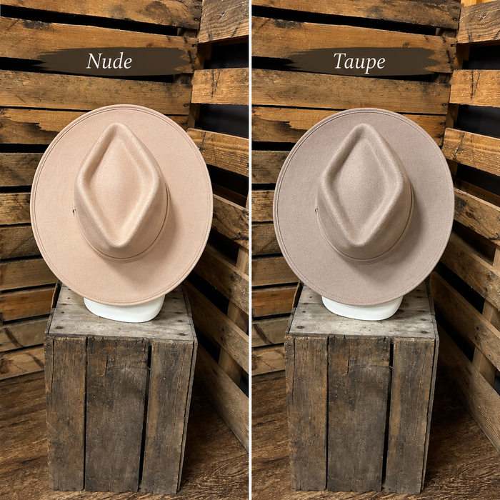 Two hats labeled 'Nude' and 'Taupe' on wooden stands against a wooden background.