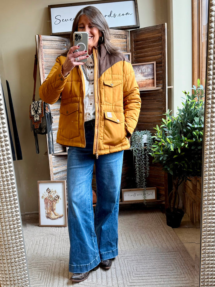 Mustard quilted coat with zip front and flap chest pockets for everyday wear