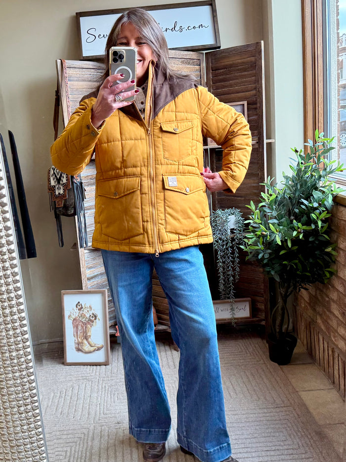 Mustard quilted coat with zip front, stand collar, and chest patch pocket detail
