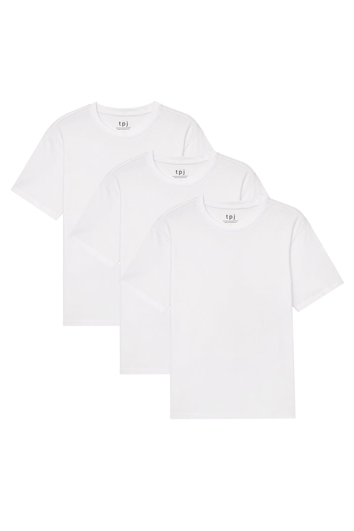 Three white crew neck t-shirts with "tpj" brand labels displayed in staggered arrangement.