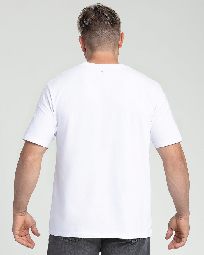 Man wearing white crew neck t-shirt, back view.