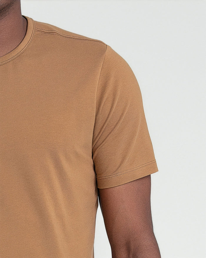 Tobacco-colored crew neck t-shirt with short sleeves and stitched seams, shown on model.