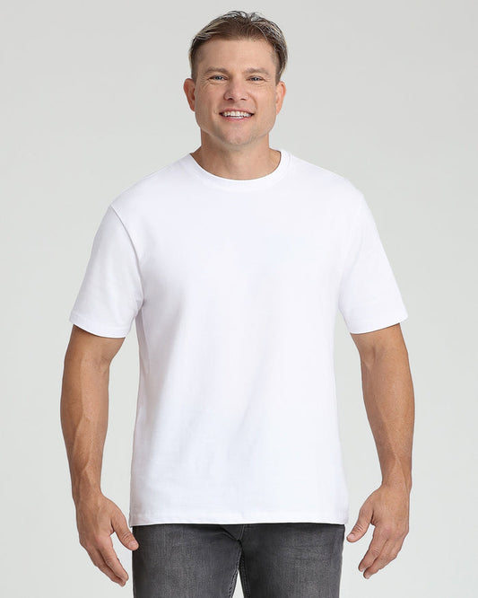White crew neck t-shirt with short sleeves on a man wearing dark jeans.