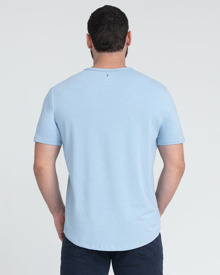 Light blue crew neck t-shirt with short sleeves, shown from the back on a model wearing dark pants.