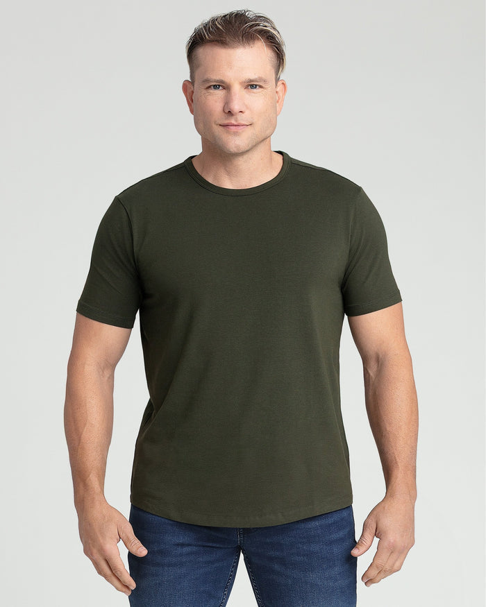Olive crew neck t-shirt with short sleeves on a model wearing dark jeans.