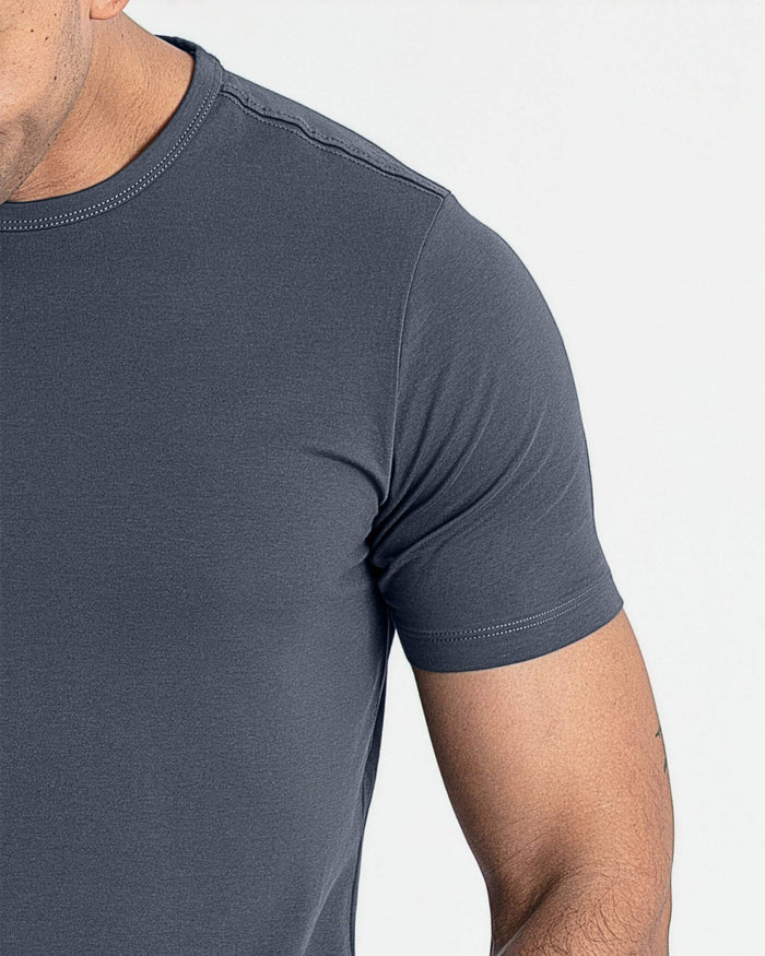 Steel gray crew neck t-shirt with short sleeves worn by a man, showing fitted silhouette and stitched neckline detail.