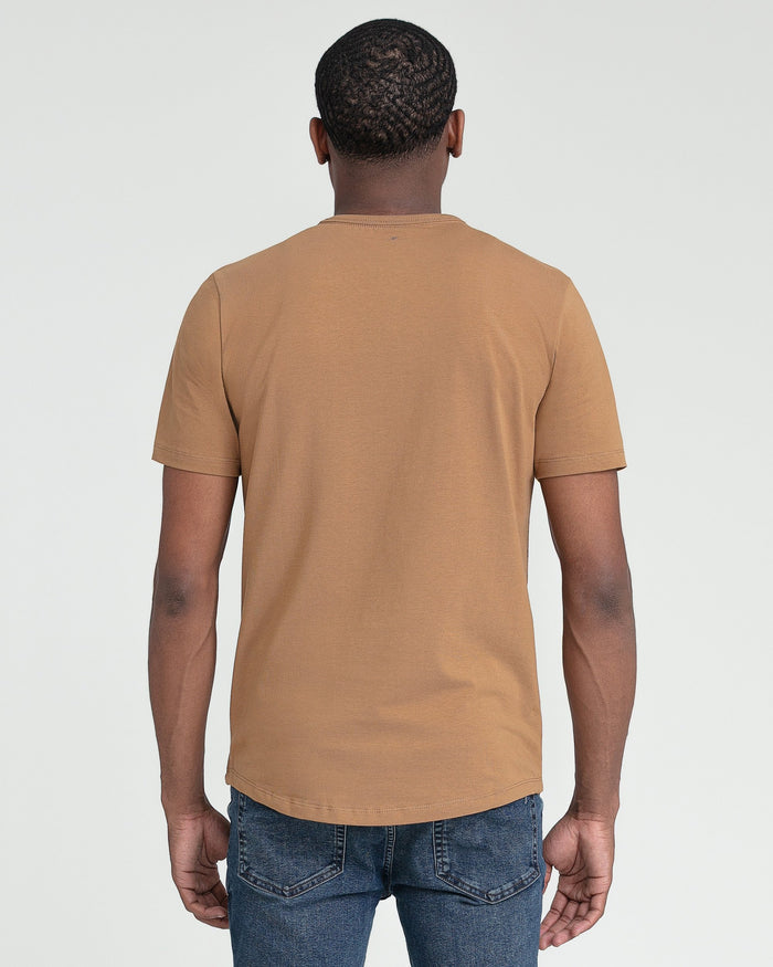 Tobacco-colored crew neck t-shirt with short sleeves, shown from back view on model wearing blue jeans.