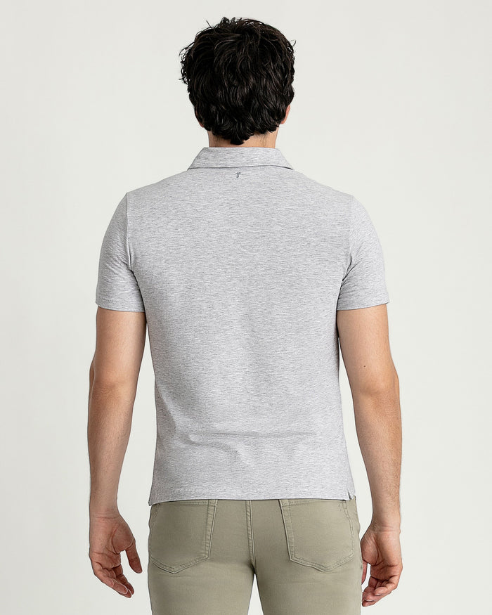Man wearing heather grey short-sleeve polo shirt with collar, shown from back view.