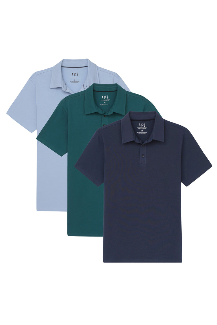 Three polo shirts in light blue, forest green, and navy blue with collars and short sleeves.