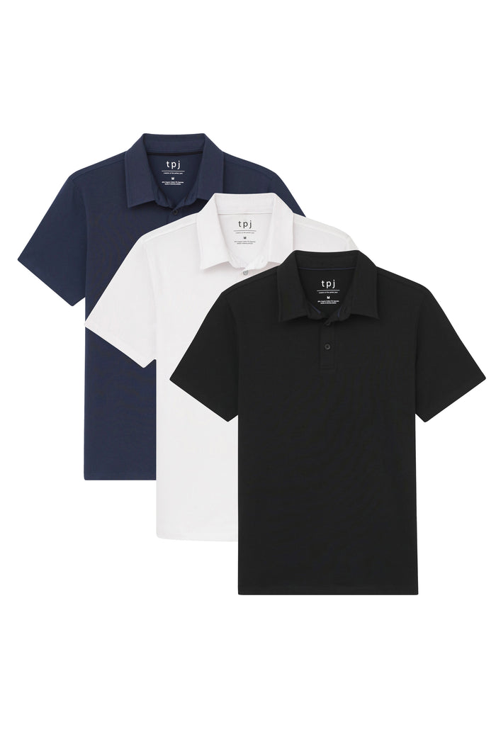 Three short-sleeve polo shirts in navy, white, and black with collars and button fronts.