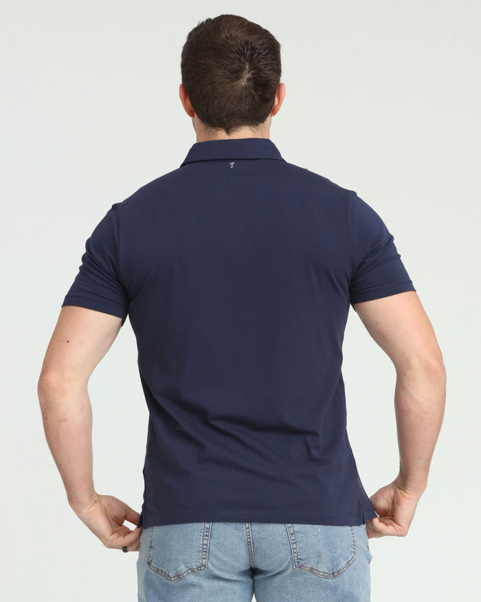 Man wearing navy blue short-sleeve polo shirt, back view.