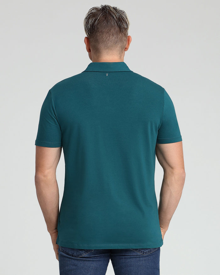 Man wearing teal polo shirt with collar and short sleeves, shown from back view.