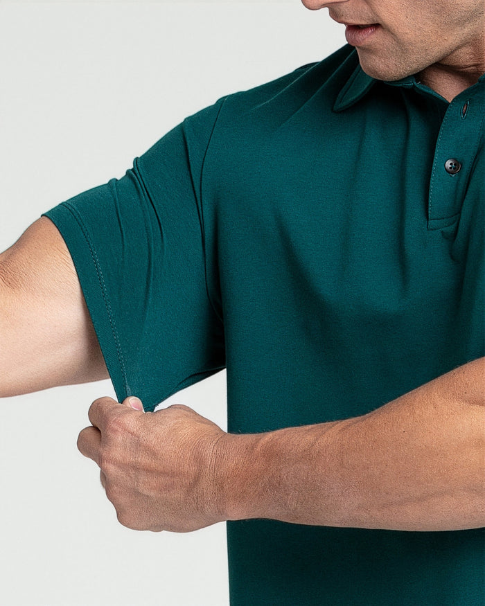 Man wearing teal polo shirt with collar and button placket.