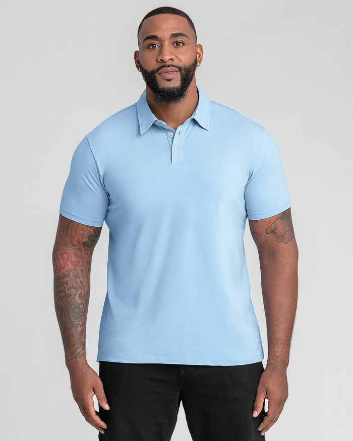 Light blue polo shirt with short sleeves and button placket, worn with black pants.