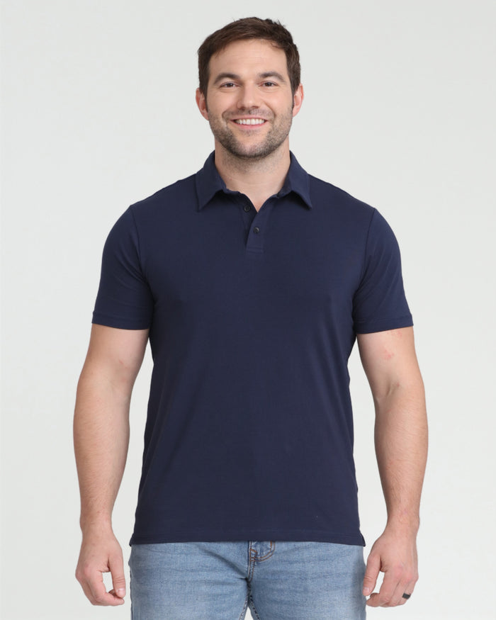 Man wearing navy short-sleeve polo shirt with button placket and collar.