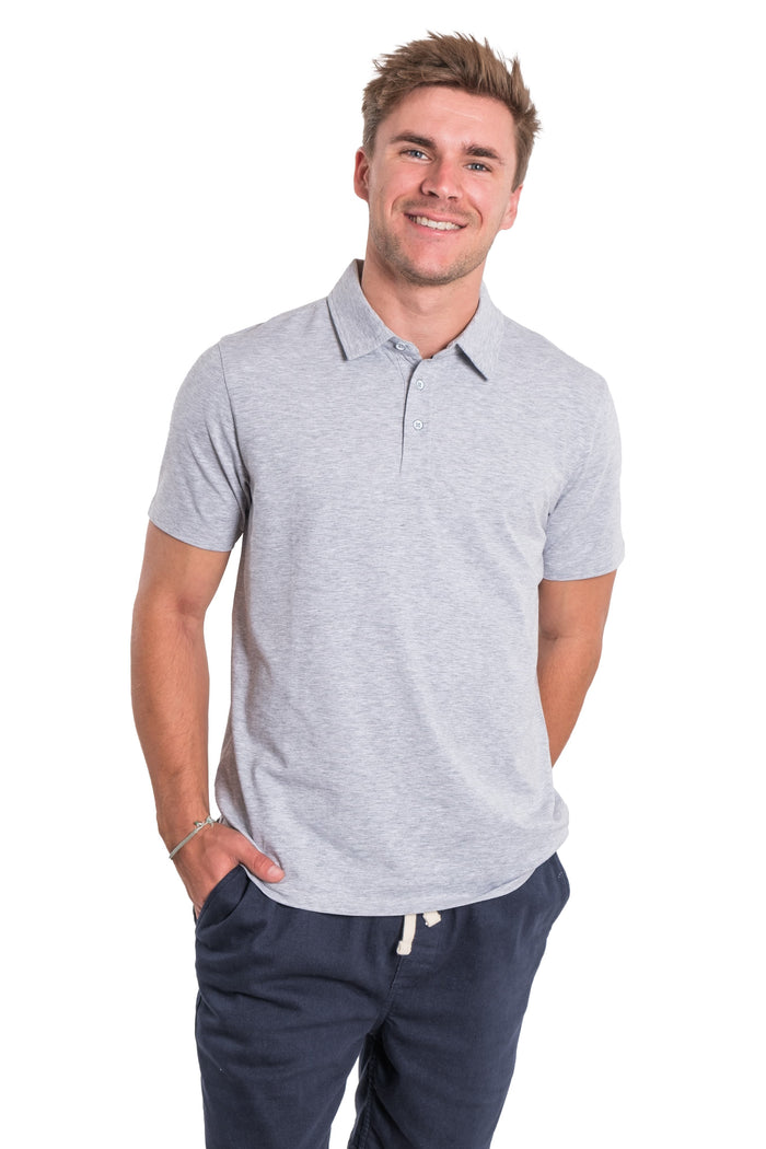 Light gray polo shirt with short sleeves and button placket, worn with navy drawstring pants.