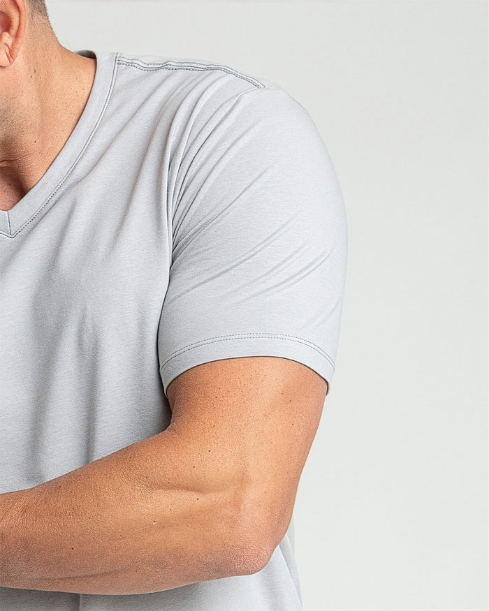 Light grey v-neck t-shirt with short sleeves and visible stitching detail on a man.