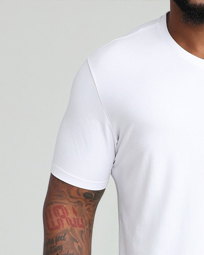 White v-neck t-shirt with short sleeves, shown on a model from shoulder to mid-torso.