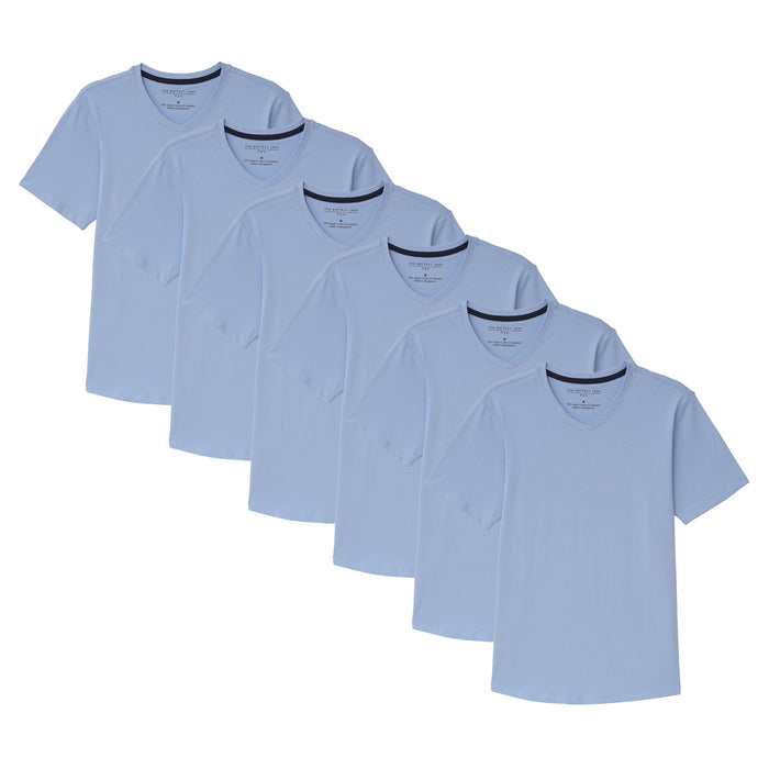 Six light blue v-neck t-shirts with short sleeves stacked in descending size order.