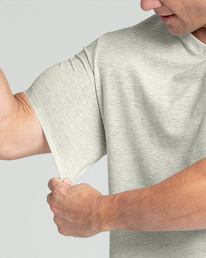 Man wearing oatmeal heather v-neck t-shirt with short sleeves.