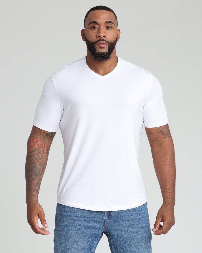 White v-neck t-shirt with short sleeves, shown on a model wearing blue jeans.