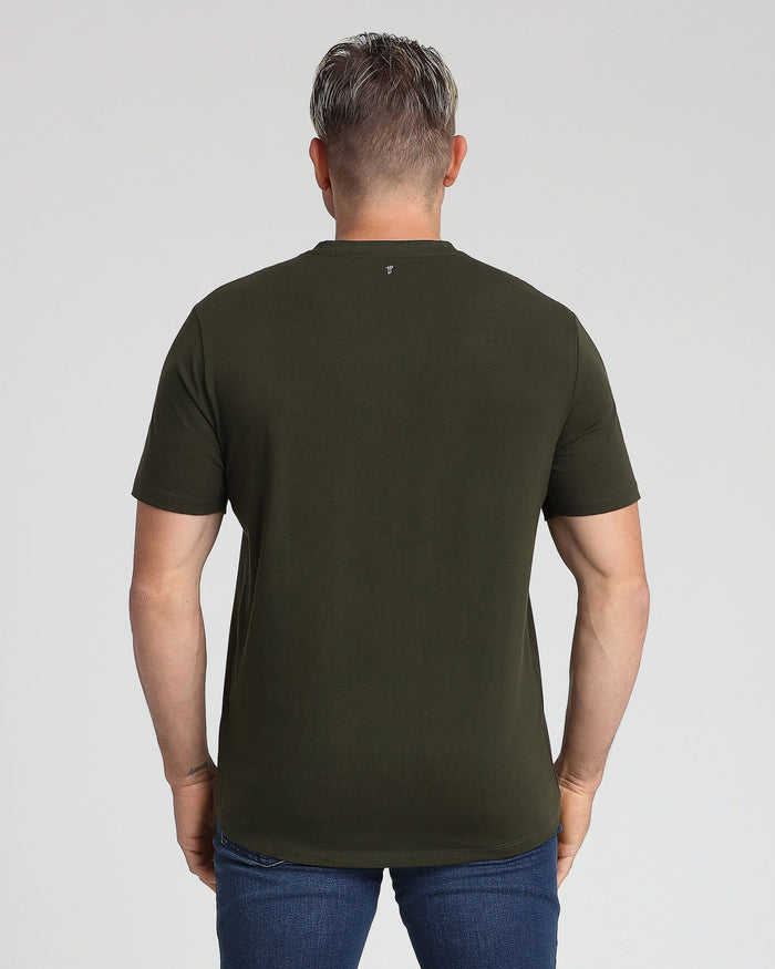 Olive green v-neck t-shirt displayed on a man shown from the back, worn with dark blue jeans.