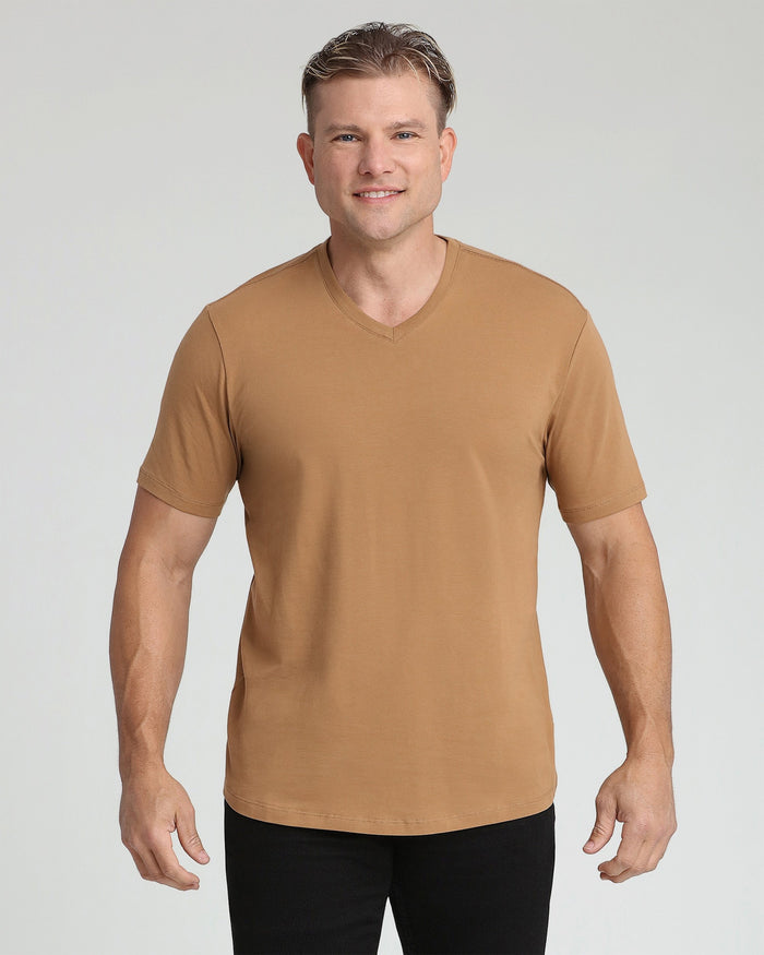 Tobacco brown v-neck t-shirt with short sleeves on a man wearing black pants.