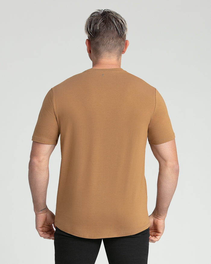 Tobacco-colored V-neck t-shirt with short sleeves, shown on a model from behind.