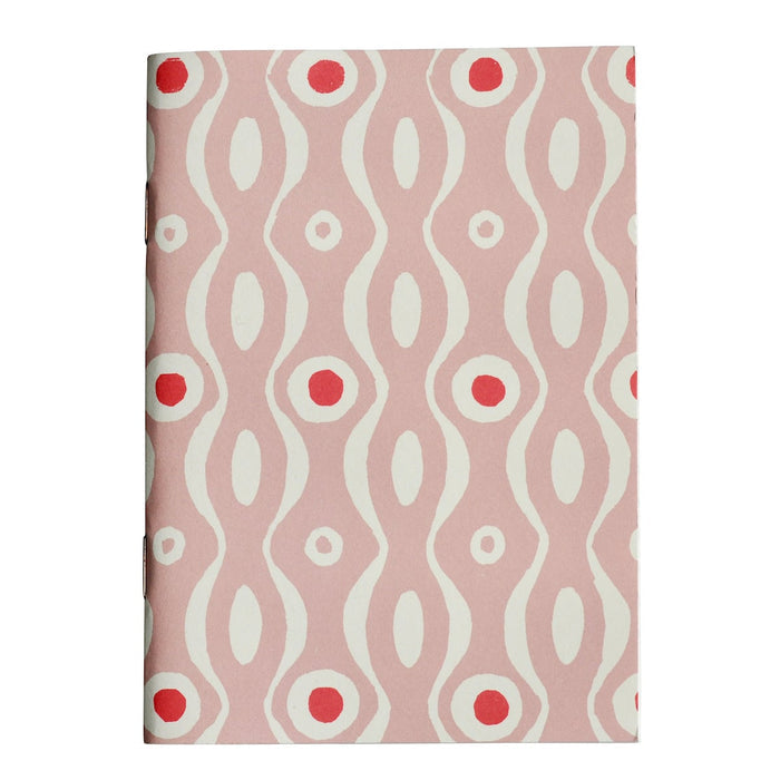 Notebook with a pink and white wavy pattern on a white background