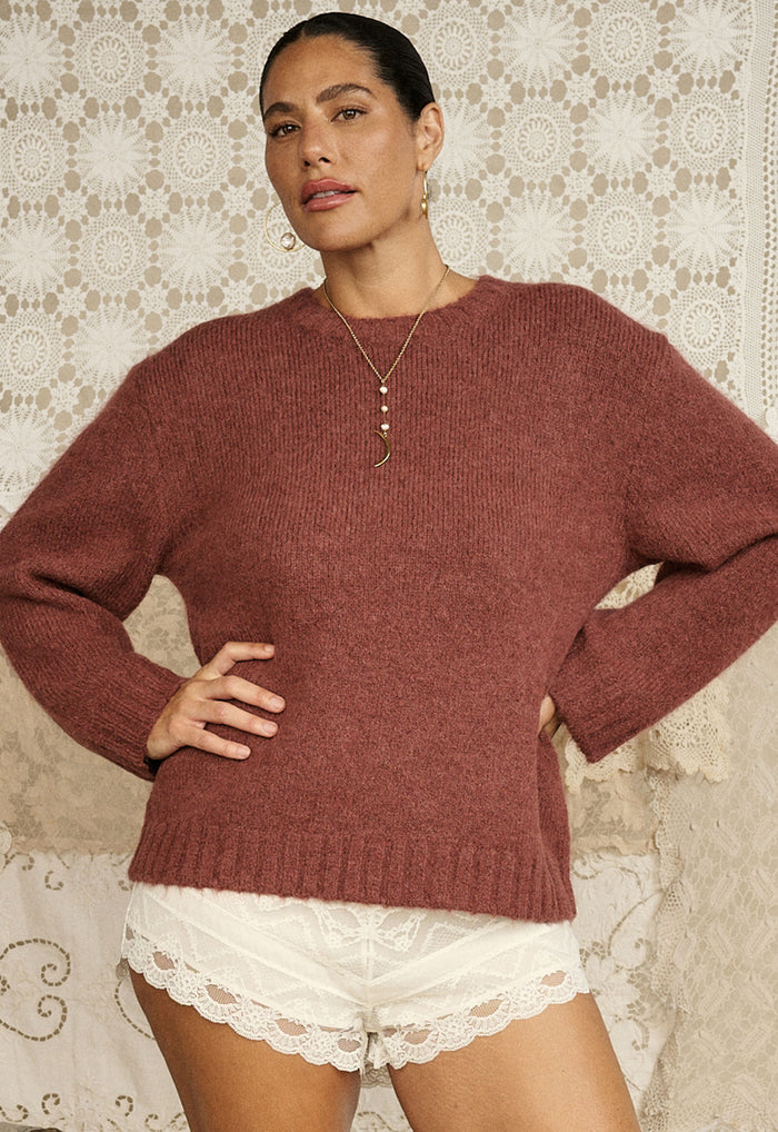 Model wearing Plum & Lucy cocoa alpaca-wool sweater front view, ribbed neckband and cuffs, lace shorts styled beneath