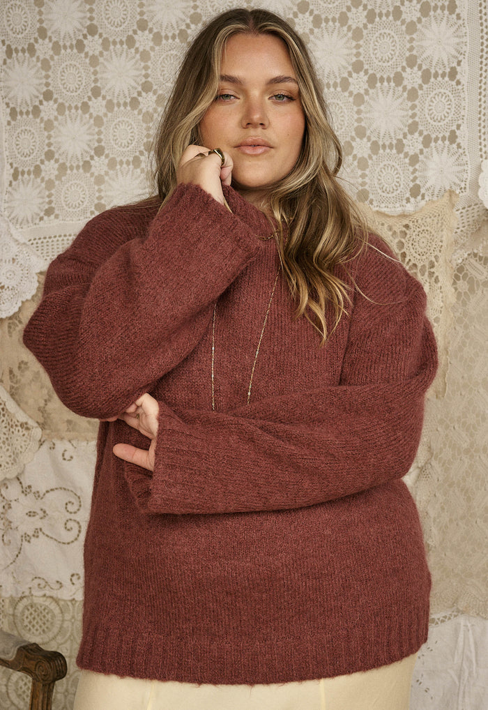 Front-facing flat lay of cocoa alpaca-wool knit sweater showing ribbed neckband, cuffs and hemband