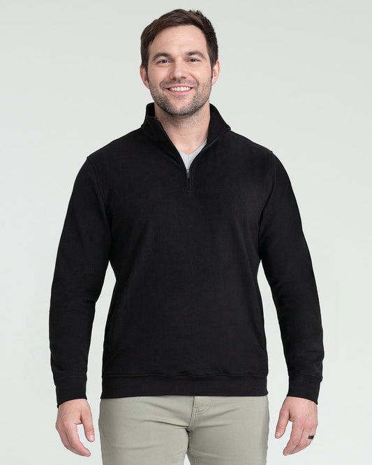 Black quarter zip pullover with long sleeves and ribbed cuffs, worn with khaki pants.