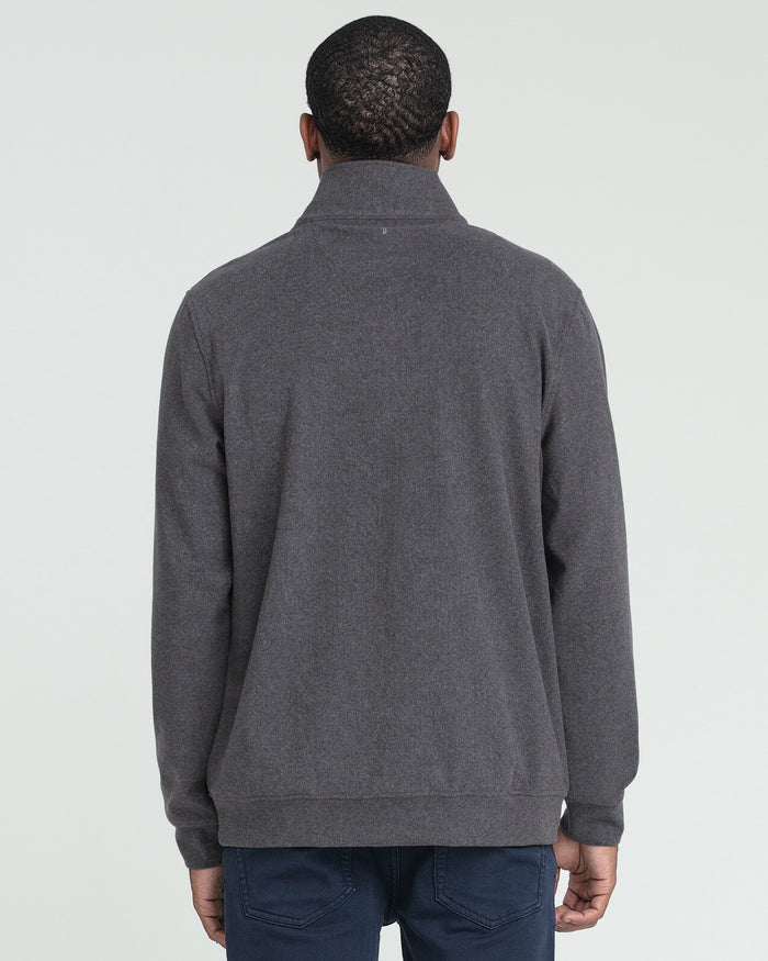 Charcoal heather quarter zip pullover shown from back, worn with navy pants.