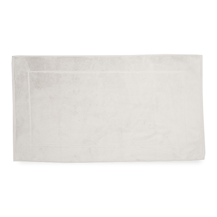 The Sarma Tab Mat uses a dreamy color palette that is woven with simple finished hems for a clean, modern look.