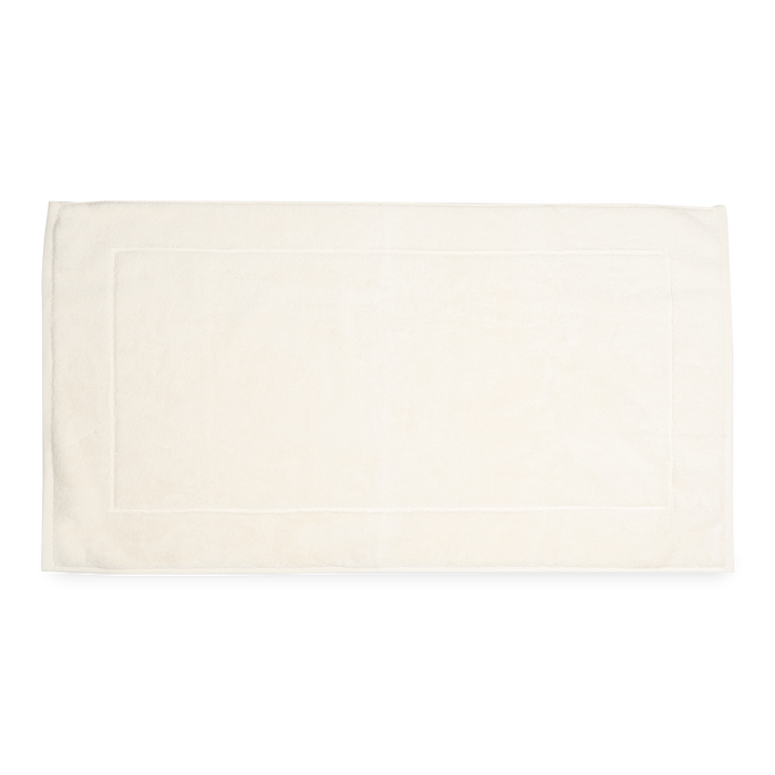 The Sarma Tab Mat uses a dreamy color palette that is woven with simple finished hems for a clean, modern look.