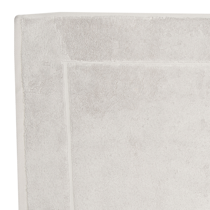 The Sarma Tab Mat uses a dreamy color palette that is woven with simple finished hems for a clean, modern look.