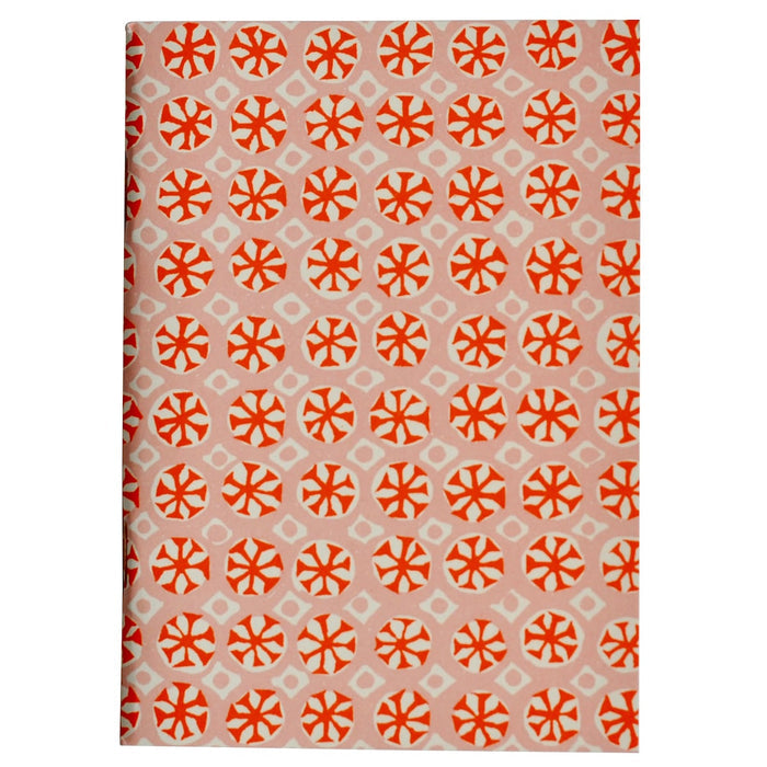 Patterned fabric with orange geometric design on a beige background