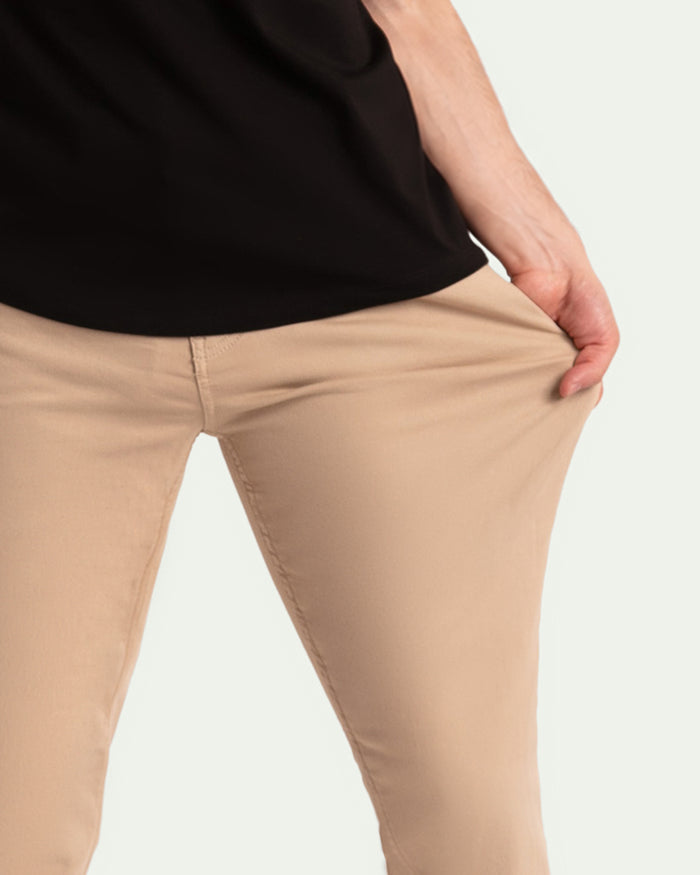 Light khaki slim fit pants with visible waistband and front seam detail.
