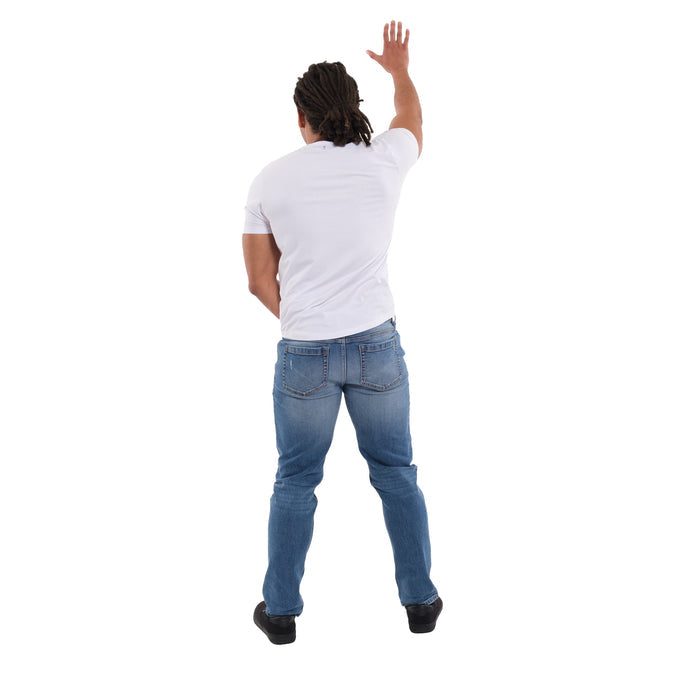 Man wearing white short-sleeve shirt and medium blue ripped jeans, shown from behind.