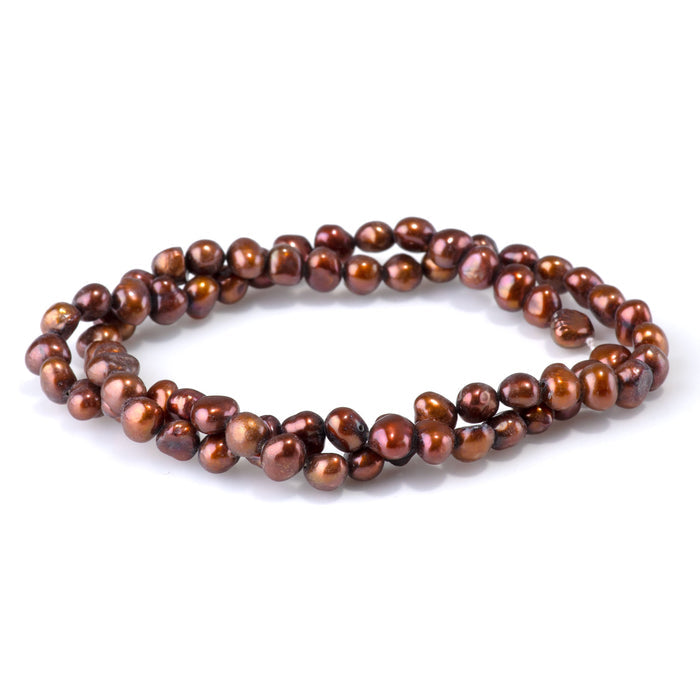 This is a Dakota Stones 5-7mm Special Price Freshwater Pearl Copper Gemstone strand with irregular beads in 15-16 inch strand.