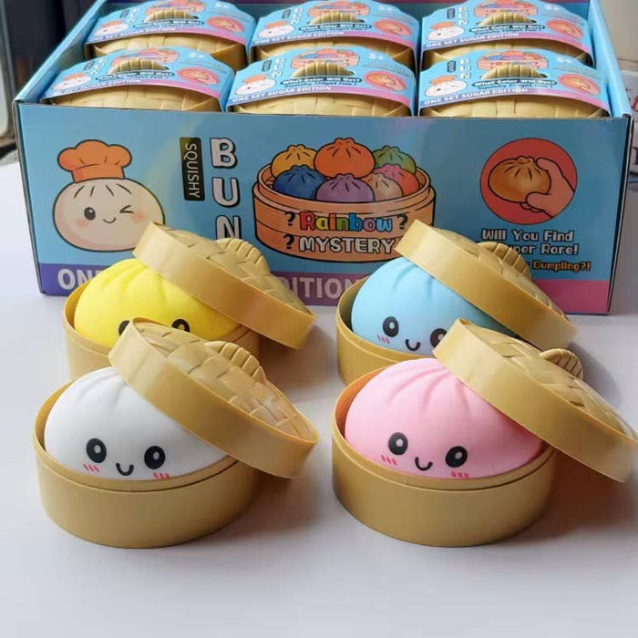 Squishy toys resembling dumplings in a box with colorful packaging.