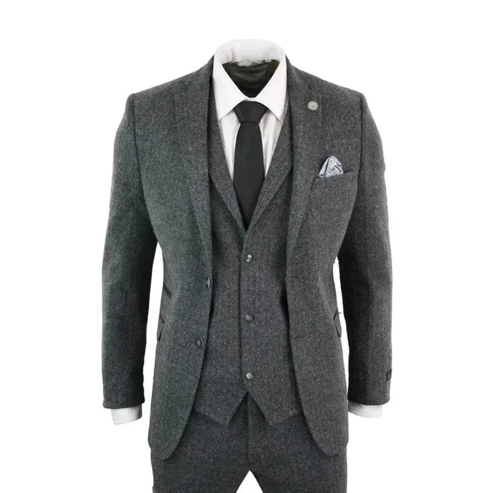 Men's grey and black tweed suit with herringbone wool fabric, tailored fit, includes blazer, waistcoat, and trousers, perfect for formal occasions.