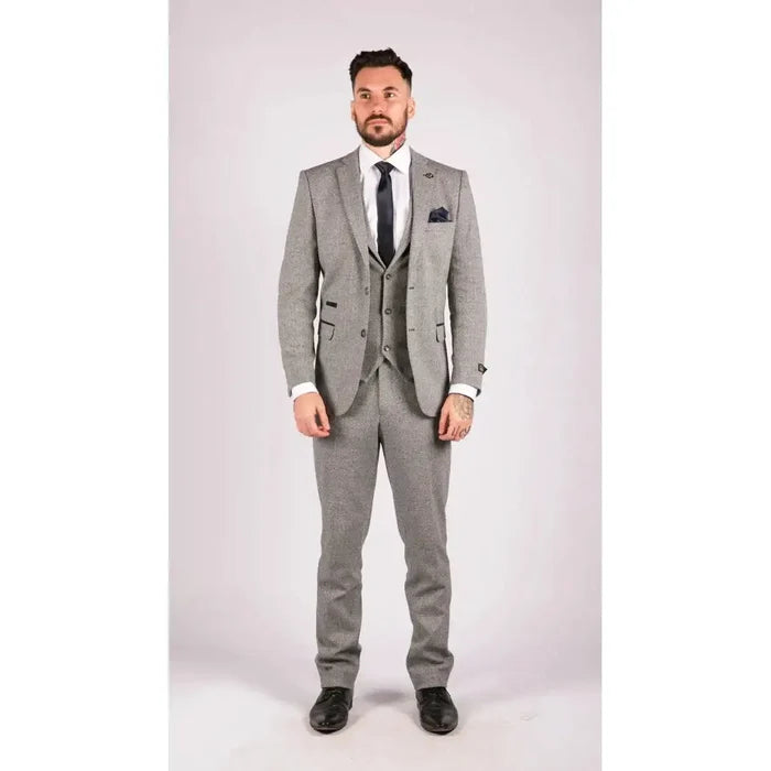 Men's grey tailored suit with matching blazer, waistcoat, and trousers in textured fabric, styled with white shirt and navy tie, modern formal look
