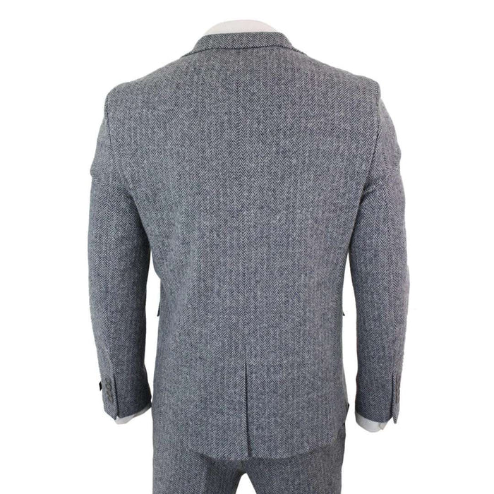 Back view of men's light grey herringbone tweed suit with structured shoulders, tailored fit, and matching trousers, perfect for vintage or retro events.