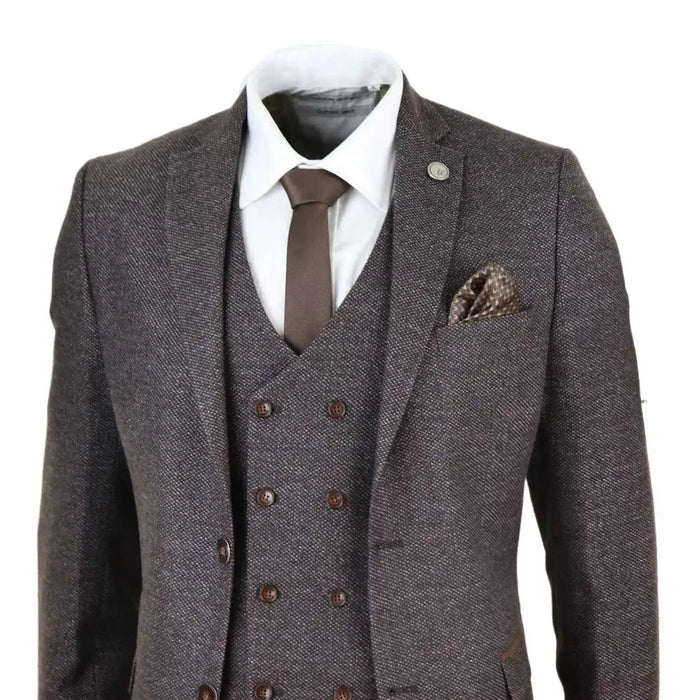 Close-up of men's gray wool tweed 3-piece suit with detailed double-breasted waistcoat, brown buttons, and textured fabric